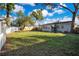 Large backyard with mature trees and partial fencing at 1523 Silver Star Rd, Orlando, FL 32804