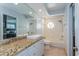 Bright bathroom featuring a granite countertop, a modern sink, and a shower-tub combination at 1591 Chippewa Trl, Maitland, FL 32751