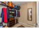 Spacious walk-in closet with ample storage space, shelving, and a mirror for convenience at 1591 Chippewa Trl, Maitland, FL 32751