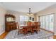 Dining area shows wood floors, light fixture, buffet, crown molding, and wooden table with seating for six at 1591 Chippewa Trl, Maitland, FL 32751