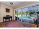 View of pool from inside, with a keyboard in foreground at 1591 Chippewa Trl, Maitland, FL 32751