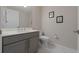 This bathroom features a gray vanity, white countertops, and modern fixtures at 16300 County Road 455 # 305, Montverde, FL 34756