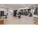 Well-equipped fitness center featuring treadmills, weight machines, and mirrors at 16300 County Road 455 # 305, Montverde, FL 34756