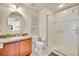 Clean bathroom featuring granite countertops, a vanity sink, and a glass-enclosed walk-in shower at 1725 Prospect Ave, Orlando, FL 32814