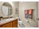 Clean bathroom featuring a vanity with a sink, toilet, and framed mirror at 1725 Prospect Ave, Orlando, FL 32814