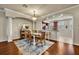 Elegant dining area with a chandelier, stylish furniture, and hardwood floors at 1725 Prospect Ave, Orlando, FL 32814