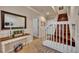 Welcoming foyer with a staircase, elegant wainscoting, and decorative console table at 1725 Prospect Ave, Orlando, FL 32814