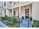 Inviting front porch with rocking chairs and neatly trimmed hedges, adding to the home's curb appeal at 1725 Prospect Ave, Orlando, FL 32814