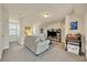 Bright living room featuring neutral colors, a comfortable sofa, and a modern entertainment setup at 1725 Prospect Ave, Orlando, FL 32814