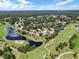 Aerial view of a community featuring lakes, a golf course, and residential homes at 1921 Redwood Grove, Lake Mary, FL 32746