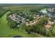 An aerial view shows many homes nestled within the lush landscape of the community at 1921 Redwood Grove, Lake Mary, FL 32746