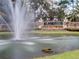 A water fountain sits in front of the stone community sign for Magnolia Plantation at 1921 Redwood Grove, Lake Mary, FL 32746