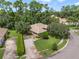 Aerial view of a single-story home with brick driveway, mature landscaping, and a tile roof at 1921 Redwood Grove, Lake Mary, FL 32746