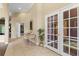 Inviting foyer featuring neutral tones, tile flooring, and a decorative console table at 1921 Redwood Grove, Lake Mary, FL 32746