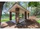 Charming gazebo with stone pillars near lake provides a serene outdoor space at 1921 Redwood Grove, Lake Mary, FL 32746