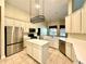 Bright kitchen featuring stainless steel appliances, a central island, and ample counter space at 1921 Redwood Grove, Lake Mary, FL 32746