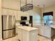 Bright kitchen featuring stainless steel appliances, a central island, and ample counter space at 1921 Redwood Grove, Lake Mary, FL 32746