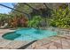 Sparkling swimming pool within a screened enclosure, enhanced by lush landscaping and serene surroundings at 1921 Redwood Grove, Lake Mary, FL 32746