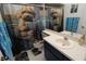 Whimsical bathroom with unique dog-themed decor and bright lighting at 201 Clusterwood Dr, Yalaha, FL 34797