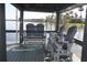 Covered dock featuring comfortable seating, perfect for unwinding and appreciating the beautiful waterfront views at 201 Clusterwood Dr, Yalaha, FL 34797