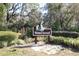 Waterwood neighborhood sign surrounded by well-maintained landscaping at 201 Clusterwood Dr, Yalaha, FL 34797