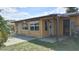 Enclosed back porch providing a versatile space for relaxation and enjoying the outdoors at 210 Dartmouth St, Deltona, FL 32725