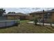 The backyard features a above ground pool, fenced yard, patio and lush lawn at 210 Dartmouth St, Deltona, FL 32725