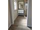 Bathroom showcasing a vanity, framed mirror, and walk-in shower with glass door at 210 Dartmouth St, Deltona, FL 32725
