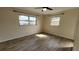 Bright bedroom with neutral walls, tile floors, and a ceiling fan at 210 Dartmouth St, Deltona, FL 32725