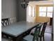 Bright dining room featuring a large marble table under a vintage chandelier at 210 Dartmouth St, Deltona, FL 32725