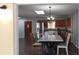 Open-concept dining room and kitchen area that offers ample space for gatherings and food preparation at 210 Dartmouth St, Deltona, FL 32725