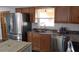 Modern kitchen featuring stainless steel appliances, granite counters, and ample cabinet space at 210 Dartmouth St, Deltona, FL 32725
