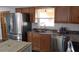 Modern kitchen featuring stainless steel appliances, light wood cabinets, and subway tile backsplash at 210 Dartmouth St, Deltona, FL 32725