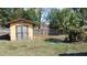 Backyard shed offering additional storage space and enhancing the functionality of the property at 210 Dartmouth St, Deltona, FL 32725