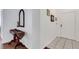 Hallway featuring tile floors, decor and a white entry door at 2305 Butterfly Palm # 102, Kissimmee, FL 34747