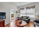 View of living area with laminate floors and screened porch in background at 2305 Butterfly Palm # 102, Kissimmee, FL 34747