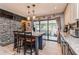 Open kitchen with granite countertops, a breakfast bar and sliding door access to the patio at 2405 Abalone Blvd, Orlando, FL 32833