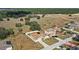 Aerial view of home featuring solar panels, fenced yard, and proximity to green space at 2537 Rock Pl, Poinciana, FL 34759