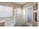 Bathroom with soaking tub, walk-in shower, and a view of the toilet area at 2537 Rock Pl, Poinciana, FL 34759