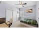 Relaxing bedroom featuring neutral tones, ceiling fan, and natural light at 2537 Rock Pl, Poinciana, FL 34759