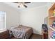 Bedroom features a cozy bed, dresser and closet at 2537 Rock Pl, Poinciana, FL 34759