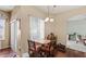 Cozy breakfast nook featuring a two-seater table and dark wood floors at 2537 Rock Pl, Poinciana, FL 34759