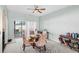 Bright dining area with carpeted floors and a sliding door to the backyard at 2537 Rock Pl, Poinciana, FL 34759