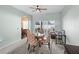 Dining area with a ceiling fan and a sliding door to the backyard at 2537 Rock Pl, Poinciana, FL 34759