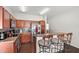 An inviting kitchen featuring rich wood cabinetry and breakfast bar at 2537 Rock Pl, Poinciana, FL 34759