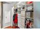 Walk-in closet with built-in shelving and drawers, providing ample storage space at 259 Westchester Dr, Deland, FL 32724