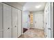 Welcoming foyer featuring tile flooring, a decorative glass accent window, closet space, and a bright entryway at 259 Westchester Dr, Deland, FL 32724