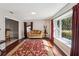 Cozy living room featuring hardwood floors, a large window with natural light, and a comfortable seating area at 259 Westchester Dr, Deland, FL 32724