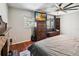 Bedroom featuring a brick fireplace and a window seat, creating a cozy and inviting space at 259 Westchester Dr, Deland, FL 32724