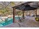 Outdoor pool area with a covered gazebo and lounge seating at 259 Westchester Dr, Deland, FL 32724